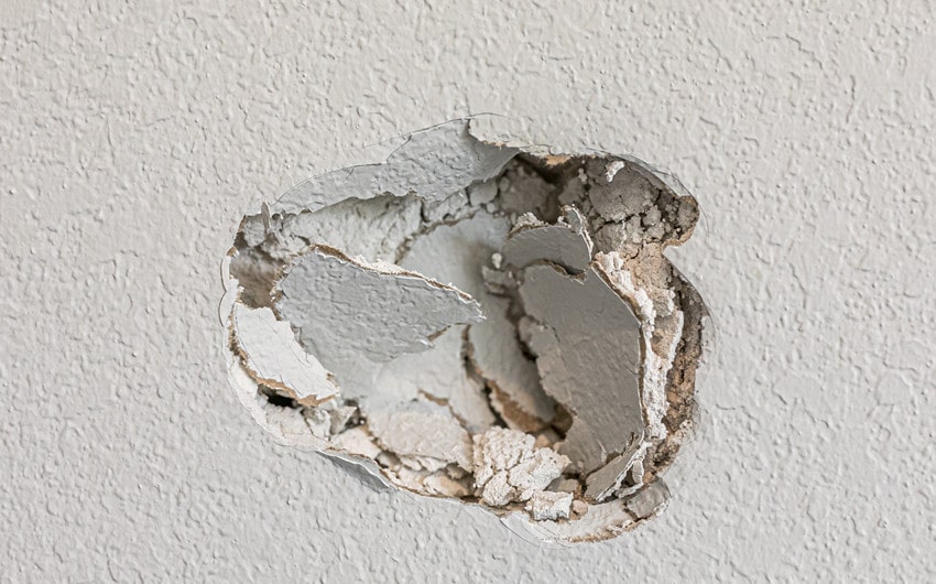 husband punched hole in wall